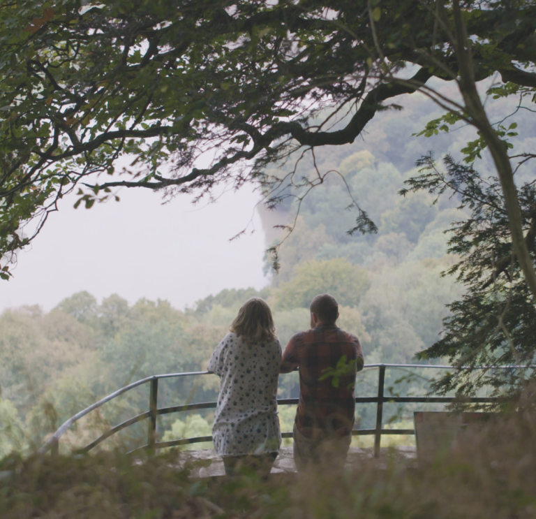 View of Nina and Joe Howden at The Eagle’s Nest, a viewpoint in the Wye Valley.